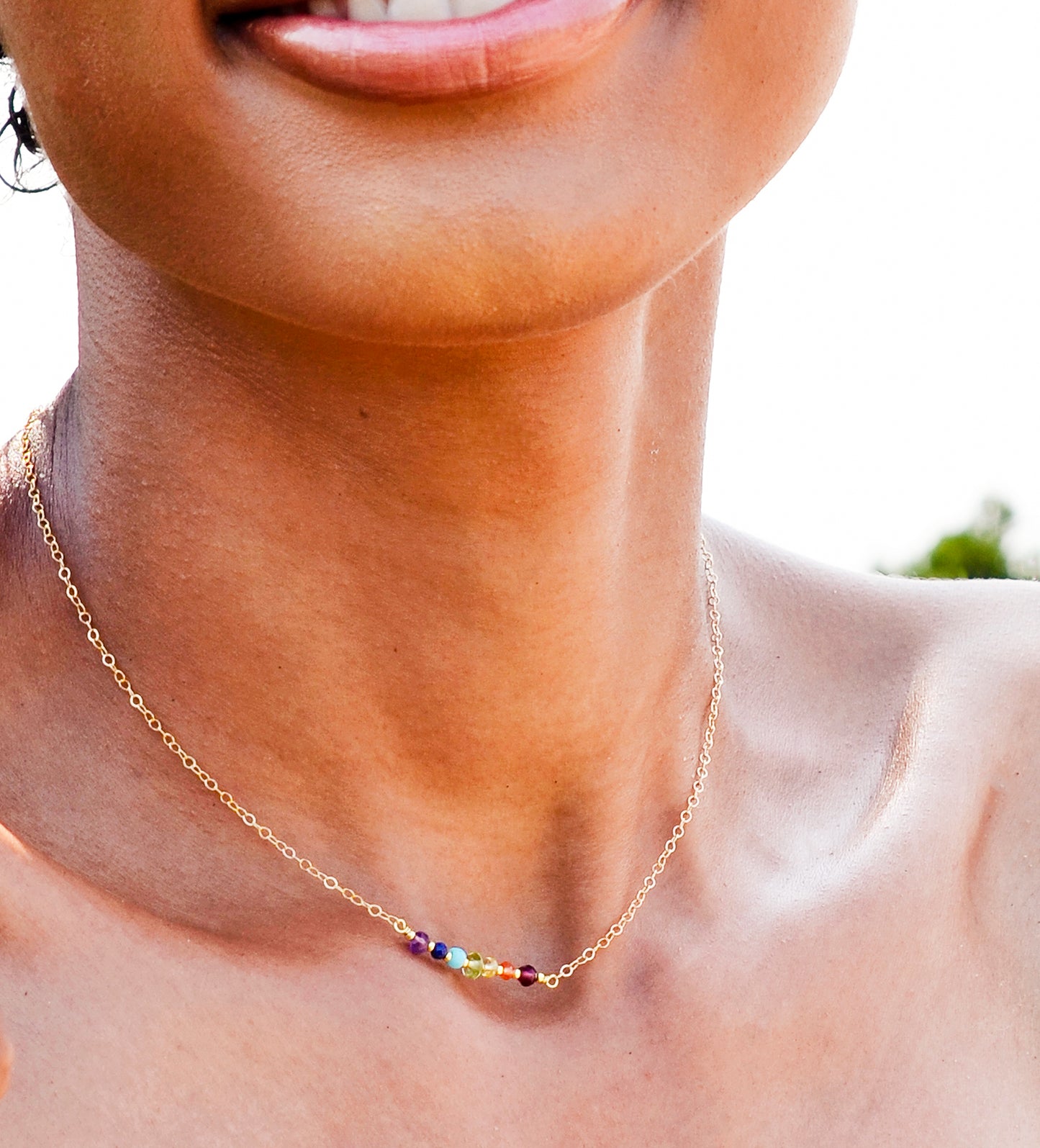 Rainbow Crystal Chakra Necklace, Handmade by GEMNIA. Modeled chakra pendant on gold or silver chain.