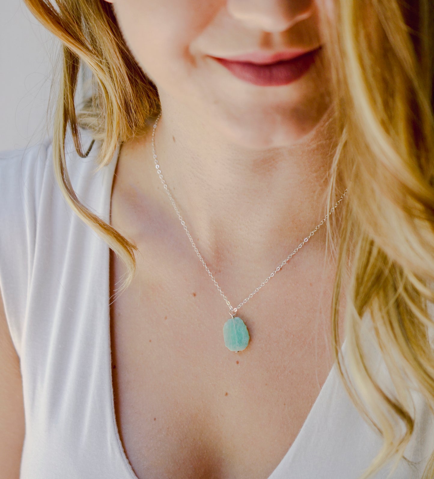 Natural raw Amazonite crystal slice set onto a sterling silver or gold filled chain. Modeled image.