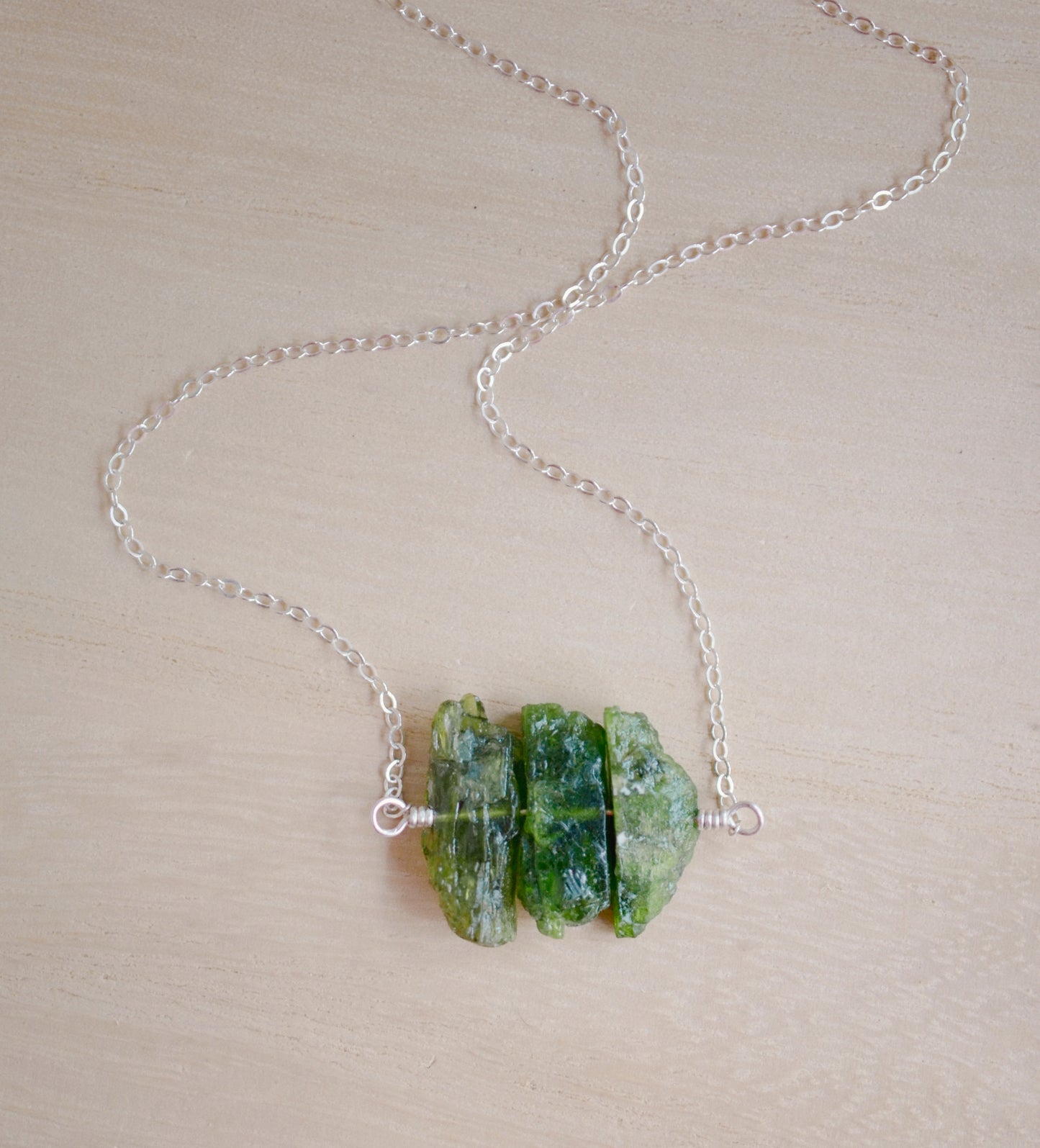 Natural green Chrome Diopside raw crystals set onto a sterling silver chain.
