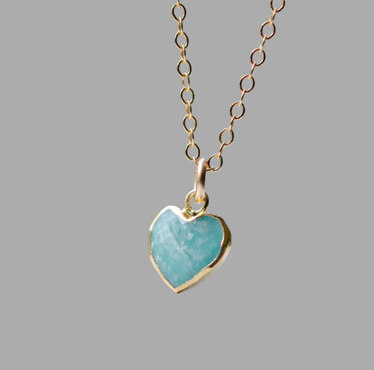 Natural blue green Amazonite gemstone pendant set on a 14k gold filled chain. The stone is a faceted heart shapr and bezeled in 22k gold electroplate.