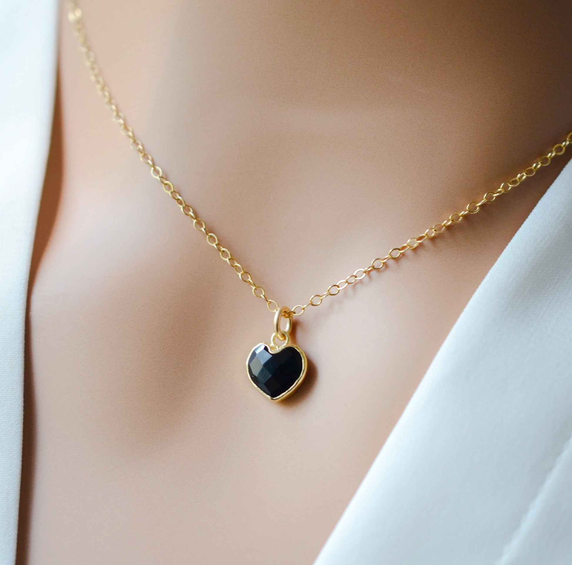 Black onyx heart pendant set on a 14k gold filled chain necklace.