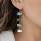 A close-up of a woman wearing a long dangle earring made of four rectangular labradorite stones in blue-green tones with 14k gold filled hooks and links.