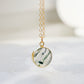 A real, natural smooth polished round Moss Agate, or Scenic Quartz, gemstone set in a gold bezel and suspended from a 14k gold filled dainty cable chain. This handmade necklace makes the perfect gift for nature lovers and gardeners.