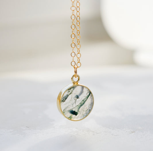 A real, natural smooth polished round Moss Agate, or Scenic Quartz, gemstone set in a gold bezel and suspended from a 14k gold filled dainty cable chain. This handmade necklace makes the perfect gift for nature lovers and gardeners.