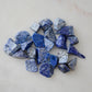 Raw blue lapis lazuli pendant options.