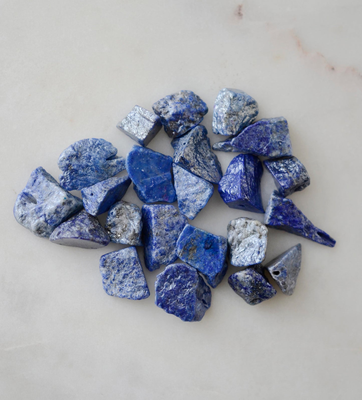 Raw blue lapis lazuli pendant options.