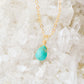 Turquoise pendant in gold.