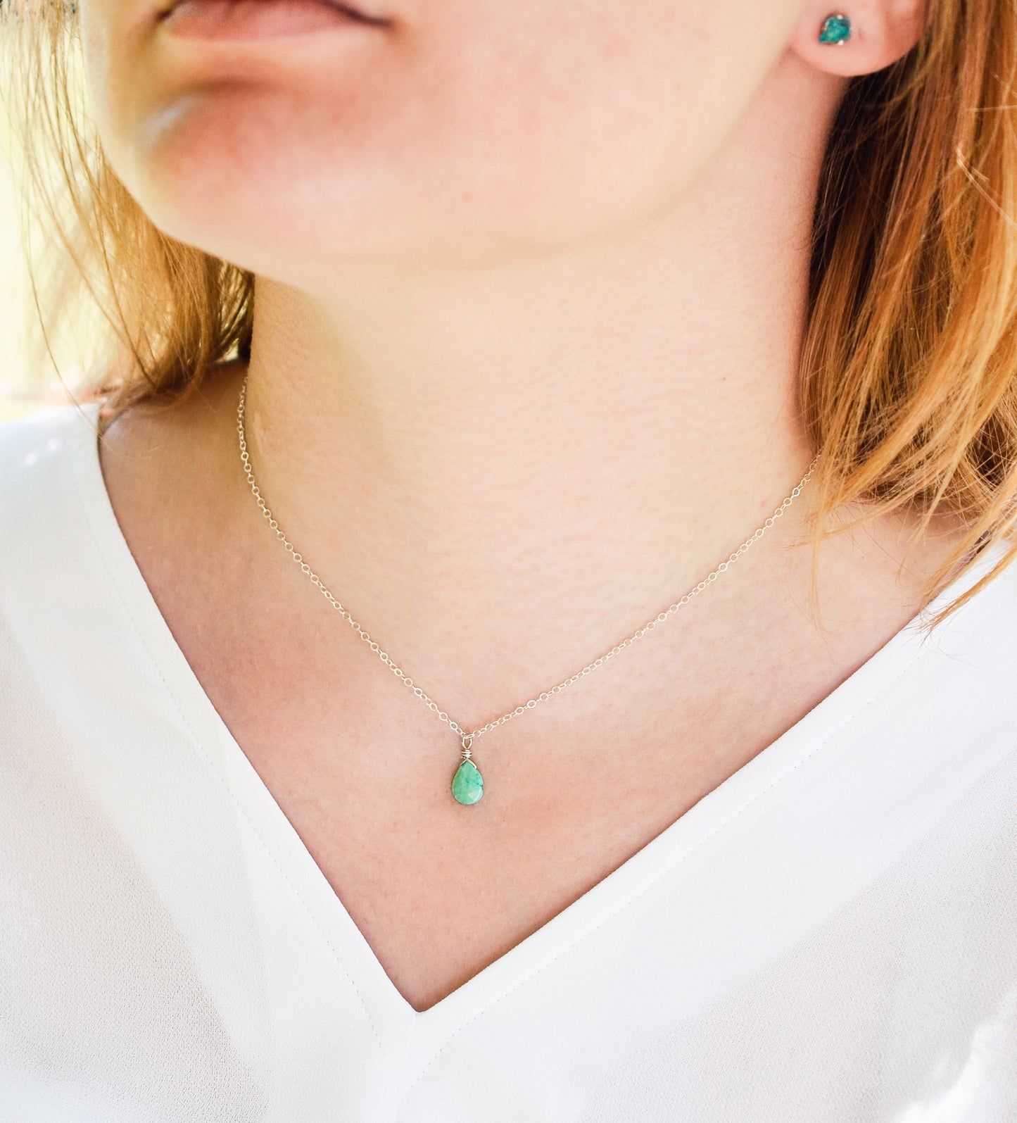 A modeled image of the turquoise teardrop necklace in sterling silver.