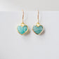 Aqua blue Amazonite gemstone heart earrings in gold. Modeled image. Natural Stones.