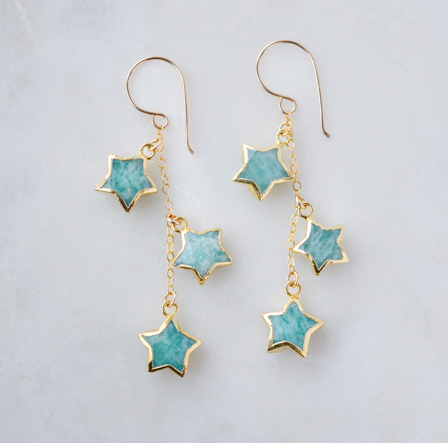 Long blue amazonite gemstone star earrings. Three stars dangle off each earring. Shown in 14k gold filled.