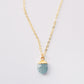 Dainty minimalist gemstone necklace with a blue faceted aquamarine teardrop pendant on a 14k gold filled chain.
