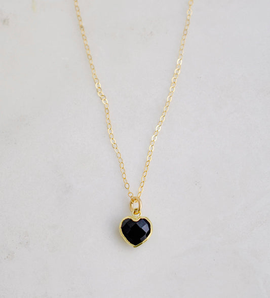 Black onyx heart pendant set on a 14k gold filled chain necklace.