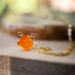 Handmade orange Carnelian Necklace. A single teardrop gemstone placed onto a sterling silver or gold filled chain. Detail Image.