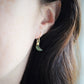 Labradorite Moon and Star earrings. One dangle is a faceted crescent moon, while the other is a star. The stones are naturally gray in color, but shift blue or green with movement. Available in gold or silver.