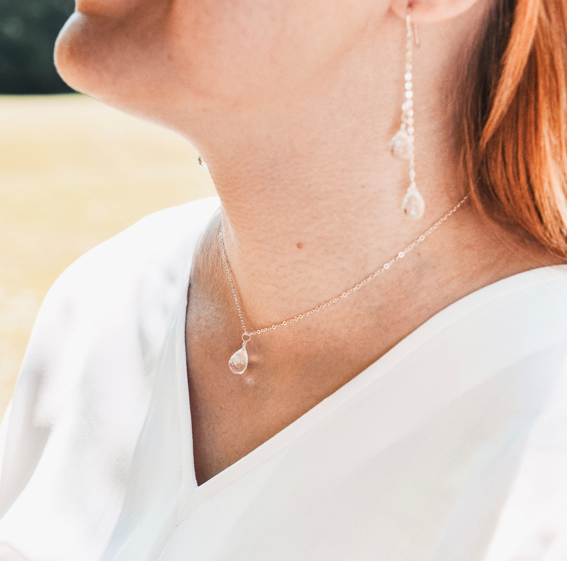 Natural clear rock crystal quartz gemstone on a sterling silver necklace chain.