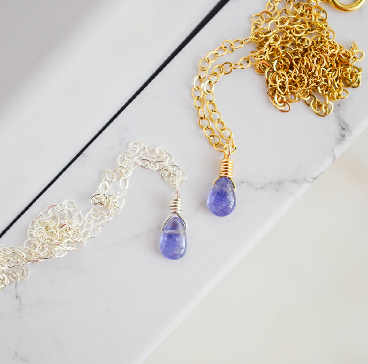 Two real, natural periwinkle tanzanite necklaces shown in sterling silver or 14k gold filled. Handmade in New England by Gemnia.