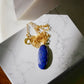 A handcrafted genuine blue lapis lazuli crystal pendant on a dainty 14k gold filled chain. This necklace is handmade in the USA by Gemnia Jewelry.
