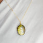 Labradorite oval pendant with yellow-green flash. The chain in 14k gold filled. 