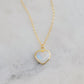 Gold heart-shaped necklace with a natural white rainbow moonstone pendant on a 14k gold filled chain. Handmade in USA artisan jewelry by Gemnia.