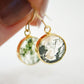 Smooth polished flat circle moss agate earrings shown in gold filled.