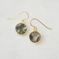 Smooth polished flat circle moss agate earrings shown in gold filled.