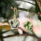 Smooth polished flat circle moss agate earrings shown in gold filled.