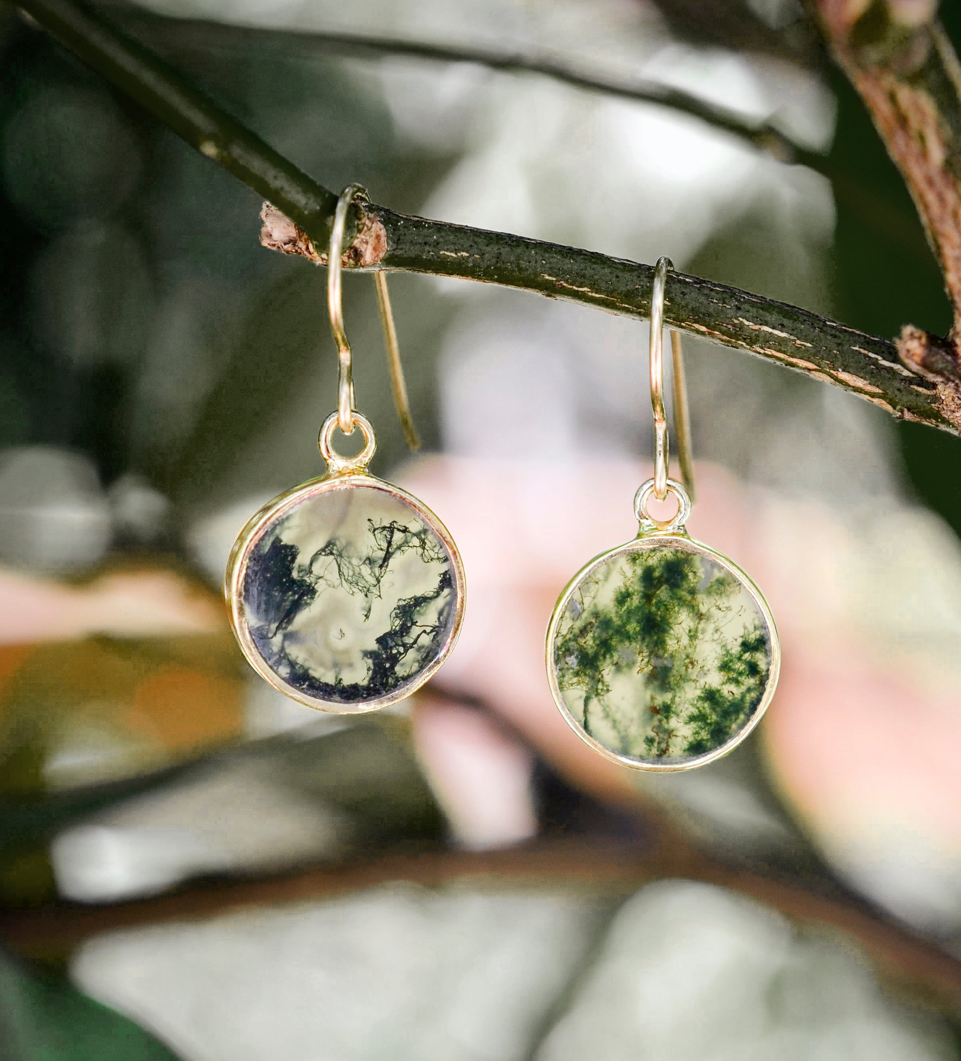 Smooth polished flat circle moss agate earrings shown in gold filled.