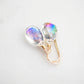 A pair of faceted mystic topaz teardrop dangle earrings in 14k gold filled. The gemstones are clear, but shift rainbow colors with movement. All jewelry is handmade by Gemnia in Connecticut. 