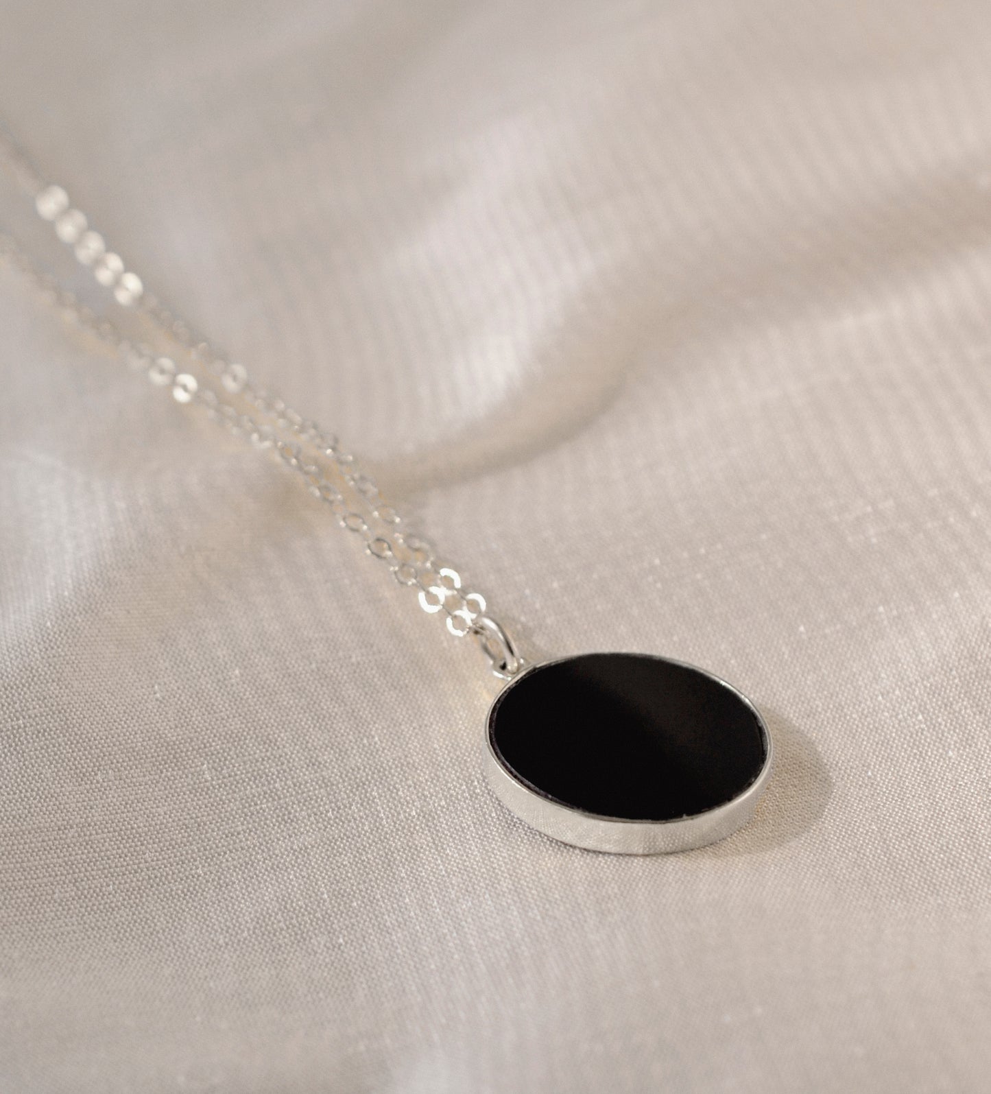 Smooth Polished Black Onyx Circle Pendant on Simple Silver Chain. 