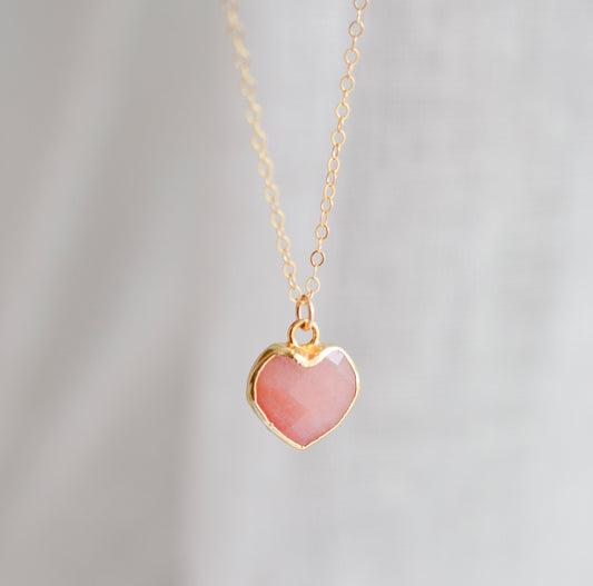 Handmade necklace with a natural pink opal heart-shaped pendant on a 14k gold filled chain. Handcrafted dainty gemstone jewelry by Gemnia.