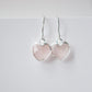 Minimalist, handmade rose quartz heart earrings featuring a faceted, sparkling heart—the stone of universal love. These cute dangles, approximately 0.5 inches (12mm/1.2cm) in size, are shown in sterling silver and are also available in 14k gold filled. They make a sweet and thoughtful gift for mom, daughter, niece, valentines day, or anniversary. 