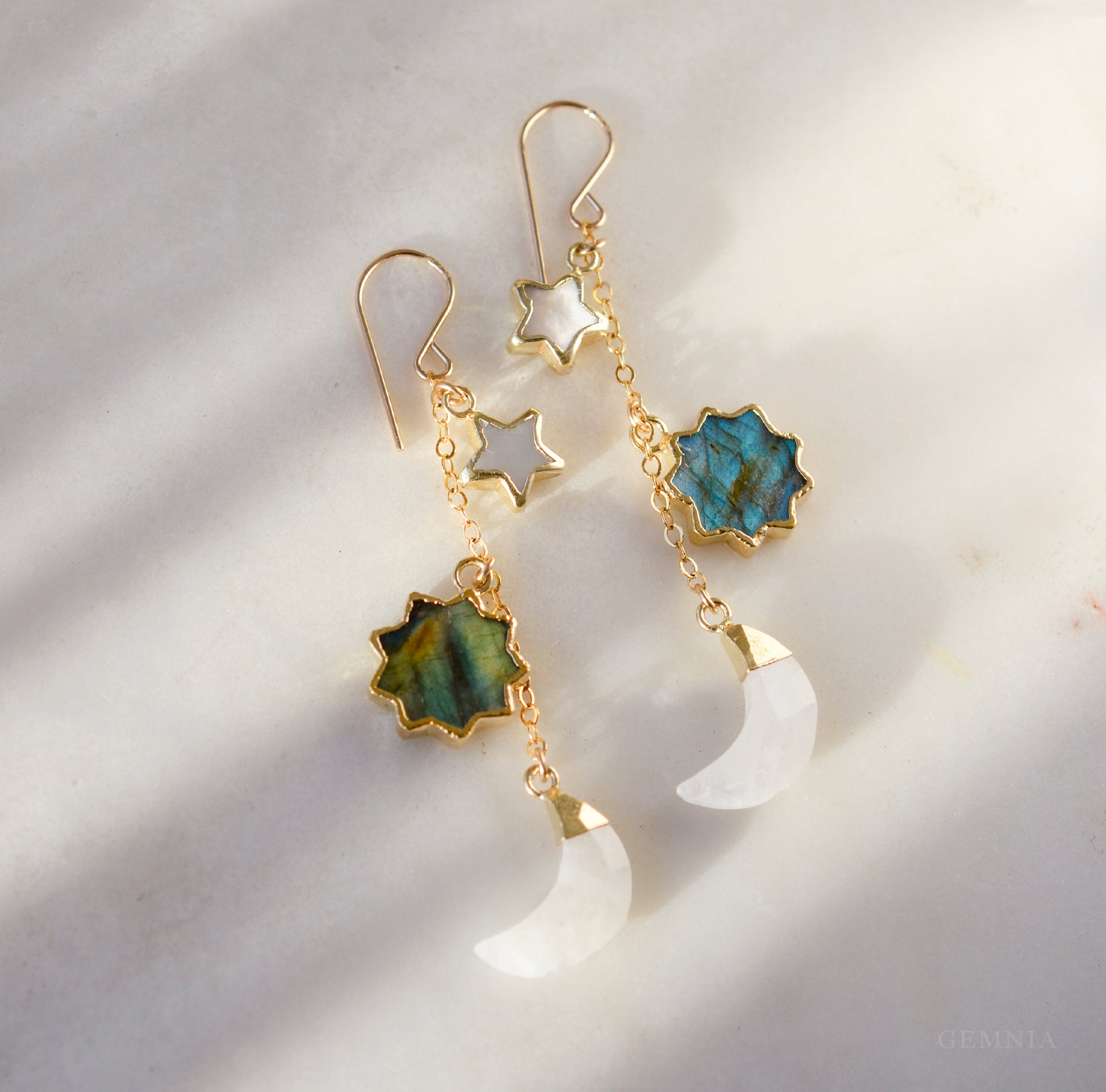 Natural labradorite, mother of pearl, and rainbow moonstone sun, moon, and star celestial earring dangles. Handmade in 14k gold filled. Dainty minimalist gemstone jewelry by Gemnia. 