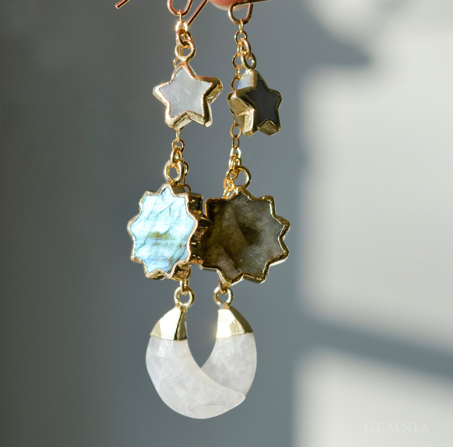 Gold sun, moon, and star celestial handmade earrings in 14k gold filled. Made in USA by Gemnia. Dainty minimalist gemstone jewelry.