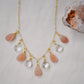 Handmade Necklace. Orange, peach Sunstone and clear Crystal Quartz teardrops dangle off a 14k gold filled chain. 