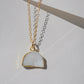 This necklace is handmade with a natural white druzy quartz pendant in a half-circle or crescent shape. Available in 14k gold filled.