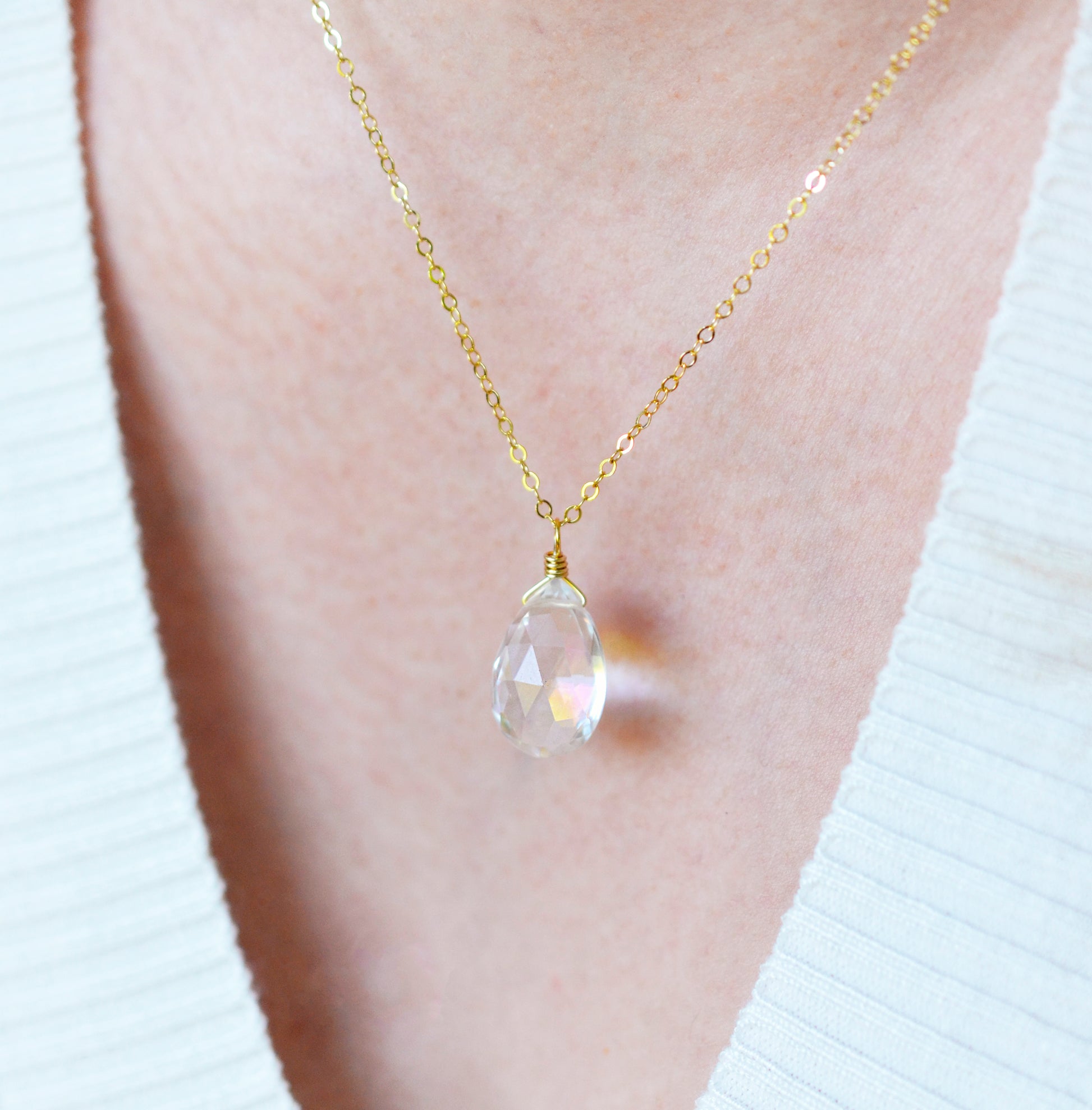Modeled image of Mystic Topaz necklace. The gemstone is a faceted teardrop shape. The 14k gold filled style is shown.