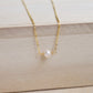 Single round white freshwater pearl necklace on a 14k gold filled chain.