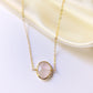 Delicate pink Rose Quartz oval coin shaped pendant with gold bezel. Chain is 14k Gold Filled.