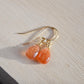 Genuine, smooth polished orange Sunstone teardrops suspended from 14k gold filled earwires.