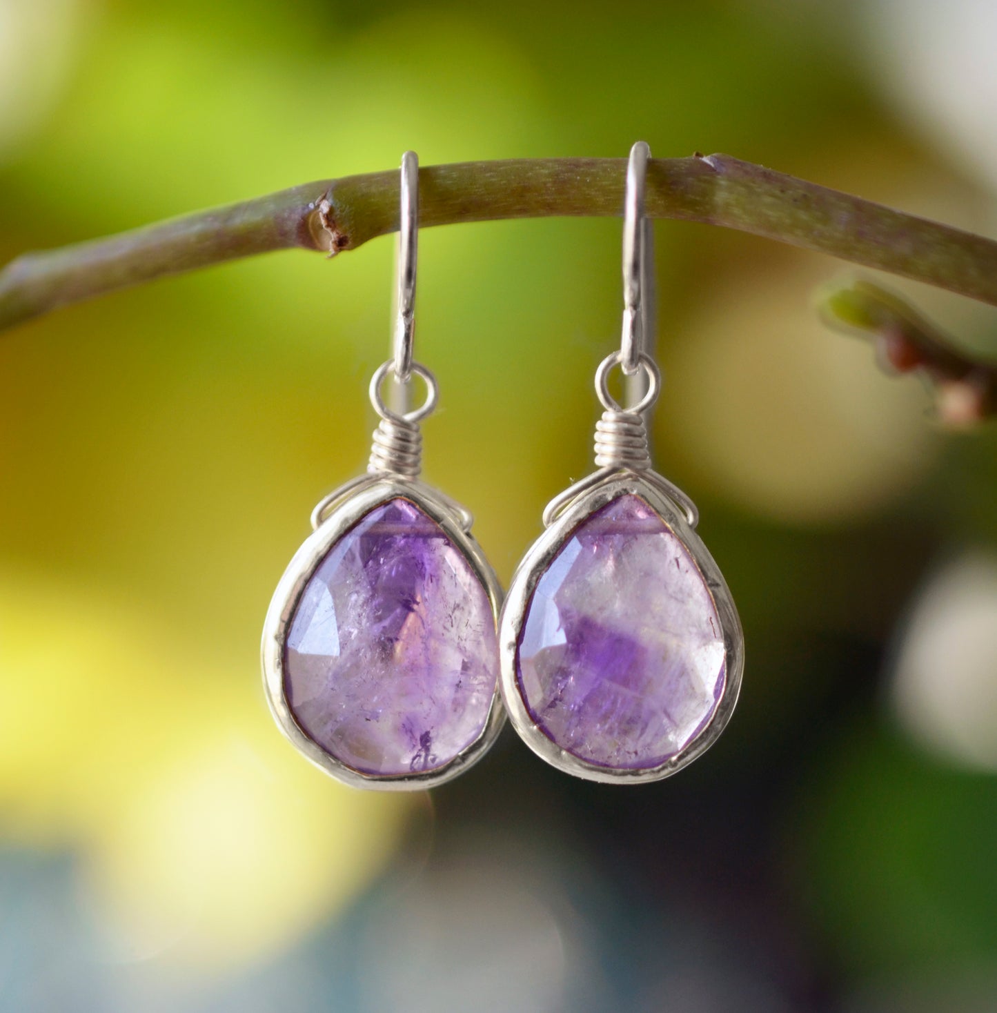Natural purple amethyst teardrops bezeled in sterling silver.