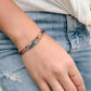 Handmade real gemstone bracelet for the Chakras or Pride. Stones include: Garnet, amethyst, topaz, emerald, carnelian, CZ, and tanzanite.