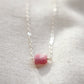 Small natural pink tourmaline crystal set onto a sterling silver chain. 