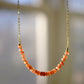 Sunstone Necklace with small faceted sunstone gems set onto a sterling silver or gold filled chain. 